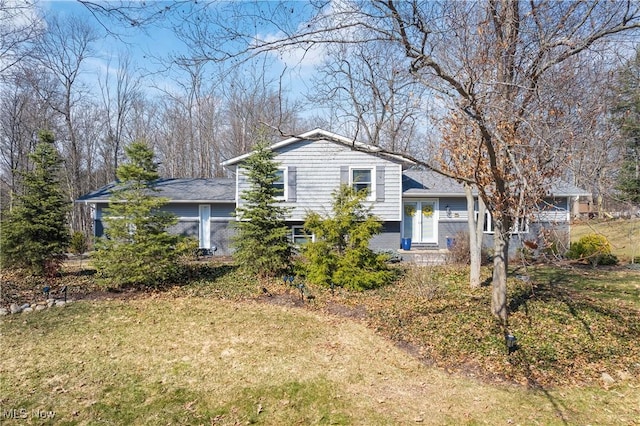 view of property exterior with a lawn