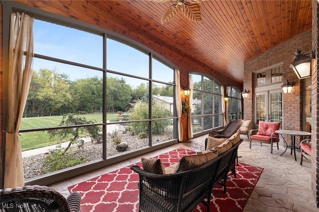 sunroom / solarium featuring plenty of natural light and wood ceiling