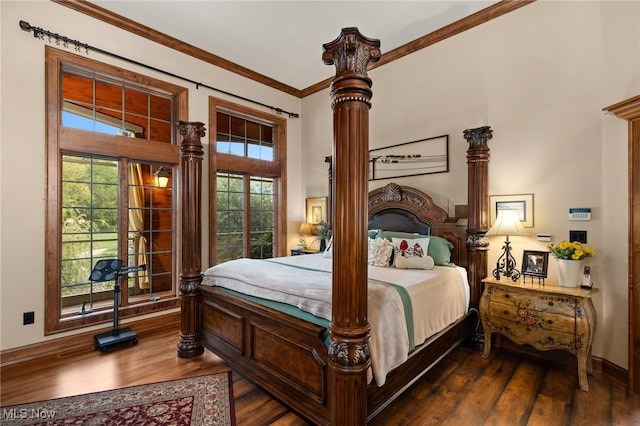 bedroom featuring crown molding, decorative columns, dark wood-style floors, and baseboards