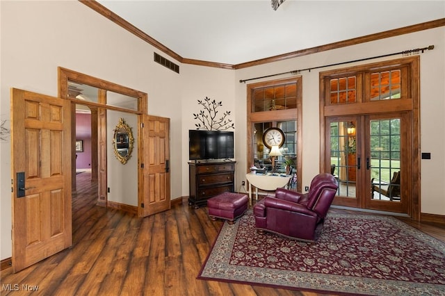 living room featuring visible vents, dark wood-type flooring, french doors, crown molding, and baseboards