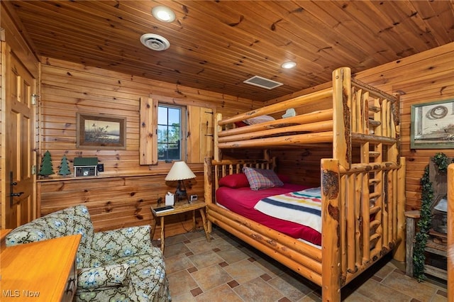 bedroom with visible vents, stone finish flooring, recessed lighting, wood walls, and wood ceiling