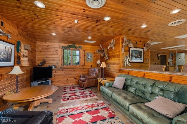 living area with wooden walls and wood ceiling