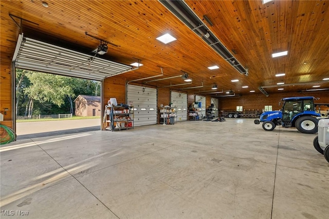 garage with wood ceiling and a garage door opener