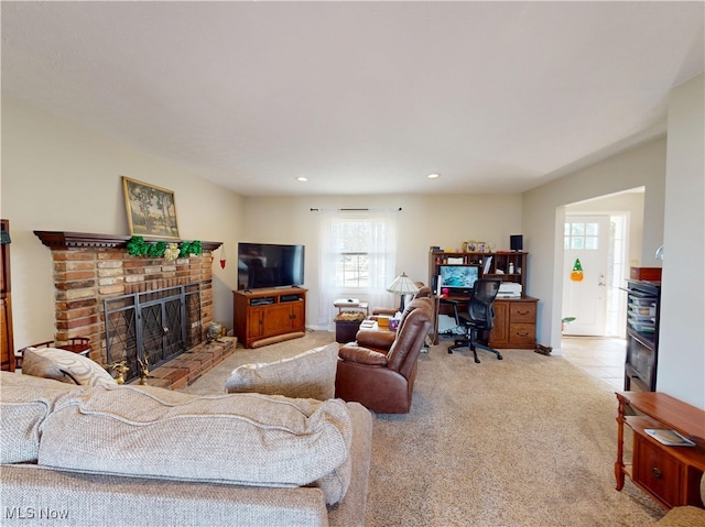 living room with recessed lighting, a brick fireplace, baseboards, and carpet floors