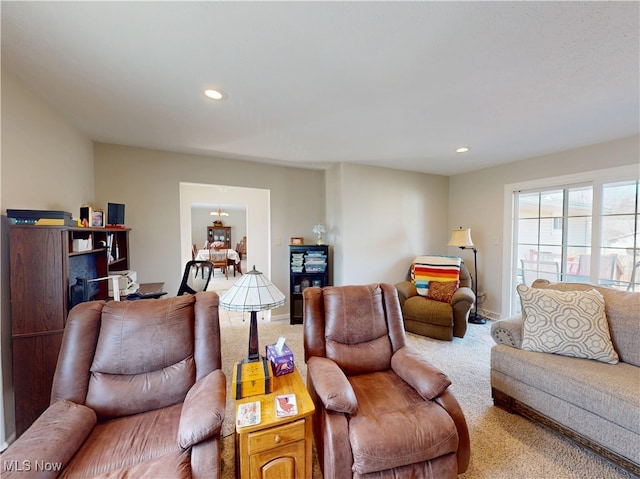 living room featuring recessed lighting and carpet