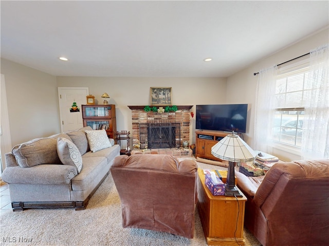 living area with recessed lighting, a fireplace, and carpet floors