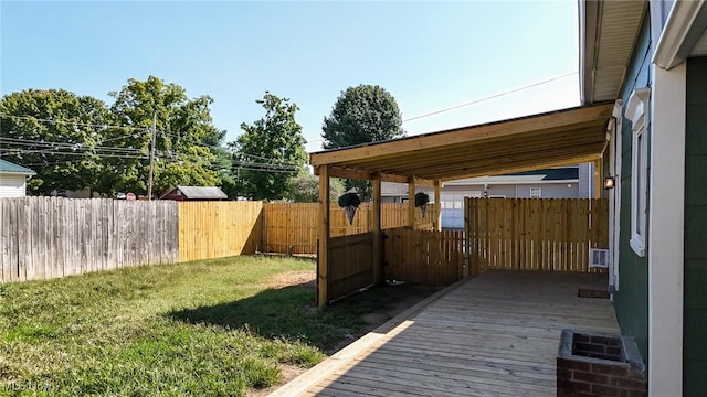 deck featuring a lawn and fence