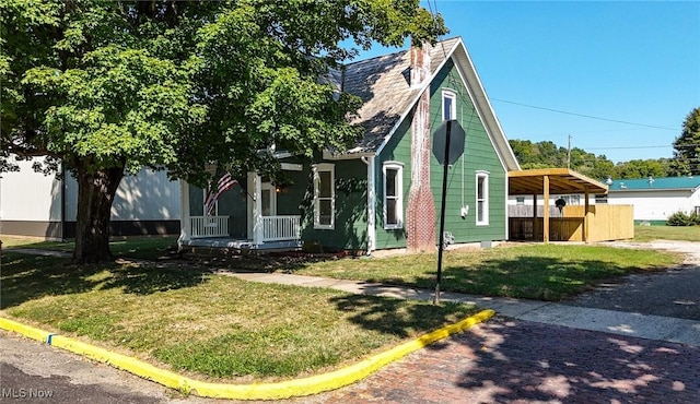 view of front of home with a porch and a front lawn