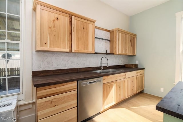1640 Main St, Stockport, OH 43787 - kitchen with dishwasher, light brown cabinetry, a sink, and light wood-type flooring