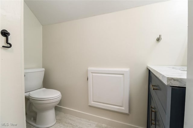 1640 Main St, Stockport, OH 43787 - half bathroom with vanity, toilet, and baseboards