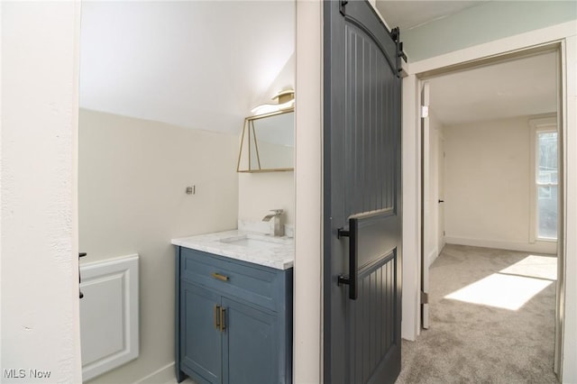 bathroom featuring vanity and baseboards