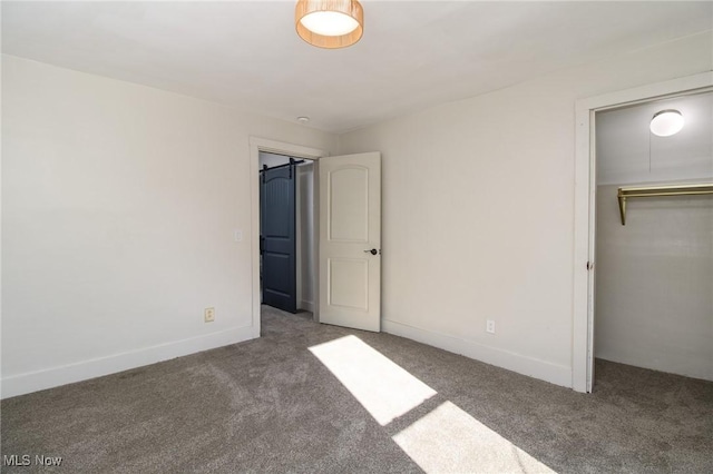 unfurnished bedroom featuring carpet, baseboards, and a closet