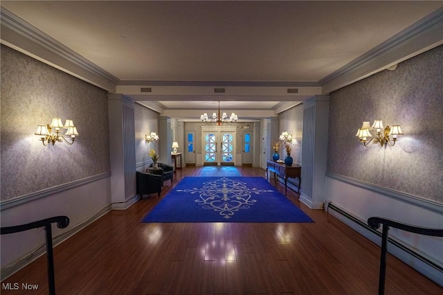 interior space featuring wainscoting, french doors, wallpapered walls, and a baseboard radiator