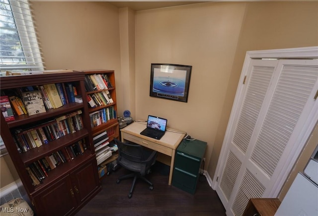 office space featuring baseboards and dark wood finished floors