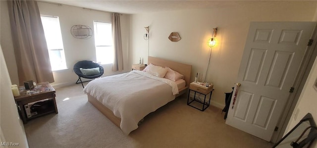 bedroom featuring light colored carpet