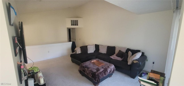 carpeted living area featuring visible vents and lofted ceiling