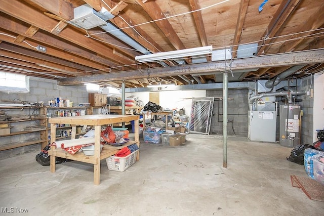 basement featuring heating unit and water heater