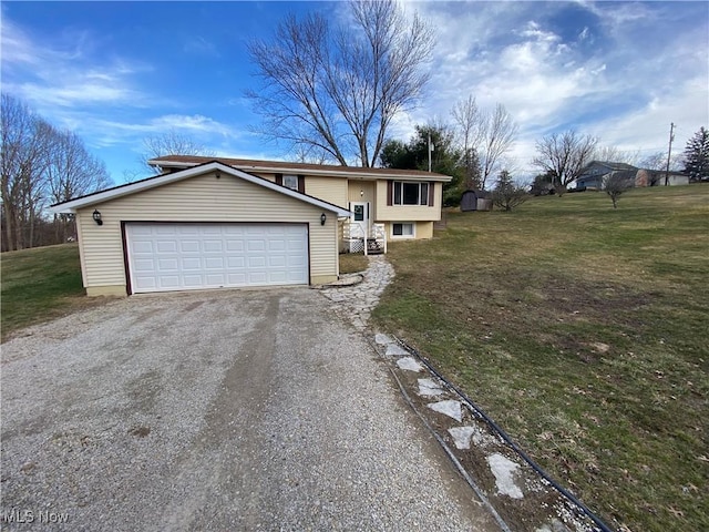 view of front of house with a garage, gravel driveway, and a front lawn