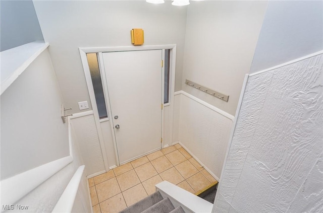 foyer featuring light tile patterned floors