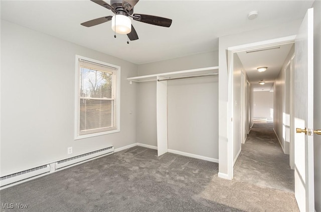 unfurnished bedroom with baseboards, carpet, a closet, and a baseboard radiator