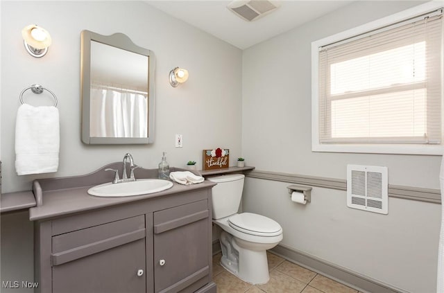 full bath featuring visible vents, toilet, vanity, and tile patterned flooring