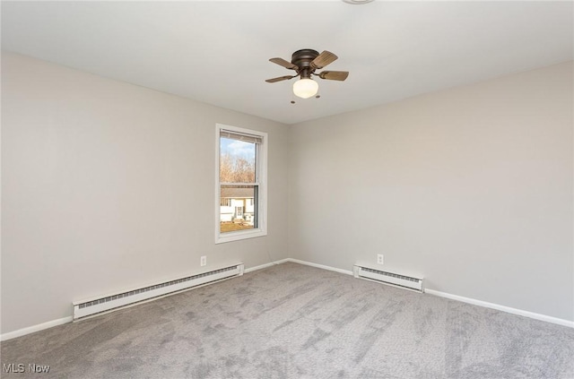 carpeted spare room with a baseboard heating unit, baseboards, baseboard heating, and ceiling fan