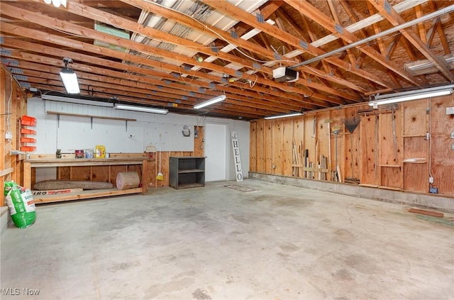 garage featuring a workshop area and a garage door opener