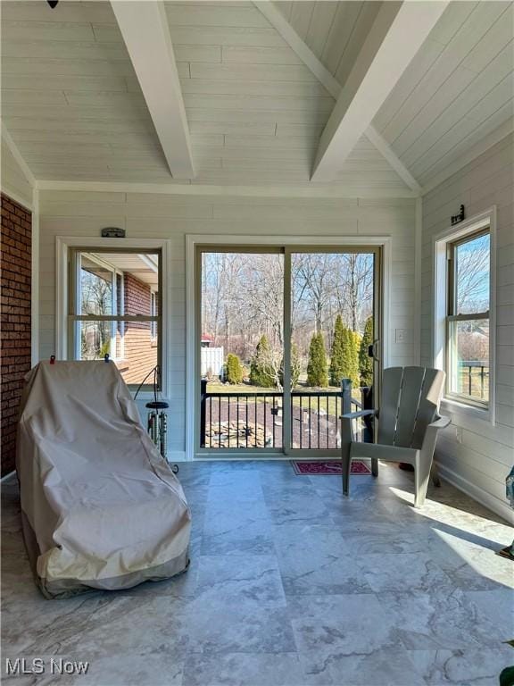 sunroom / solarium with wooden ceiling and vaulted ceiling with beams