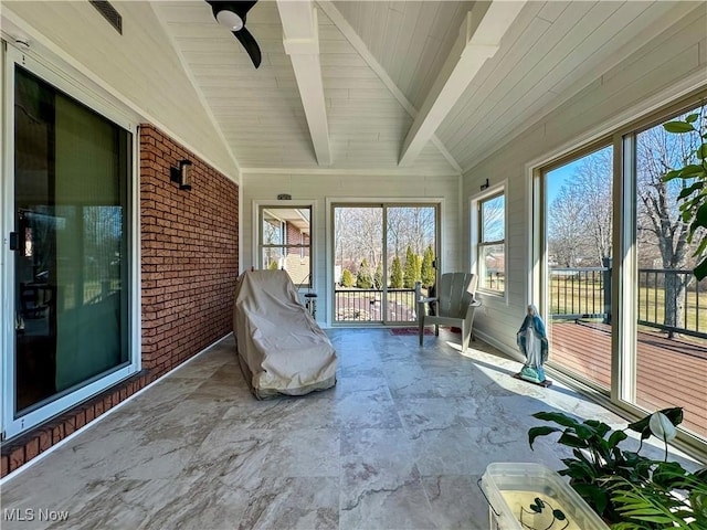 unfurnished sunroom featuring wood ceiling and vaulted ceiling with beams