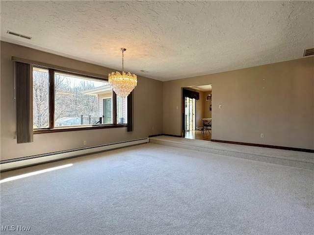 unfurnished room featuring visible vents, a baseboard heating unit, baseboards, carpet flooring, and a notable chandelier