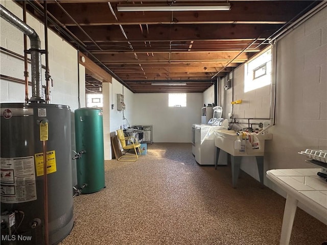 below grade area featuring independent washer and dryer and water heater