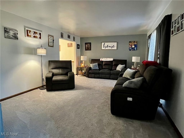 living room with carpet and baseboards