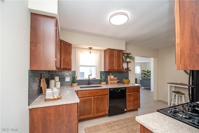 kitchen featuring decorative backsplash, brown cabinets, dishwasher, and a sink