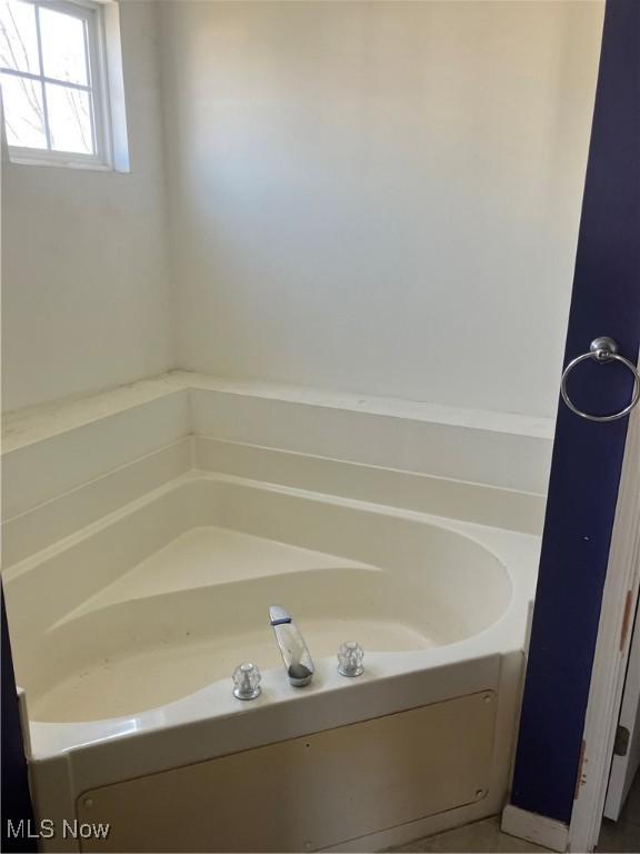 bathroom featuring a garden tub