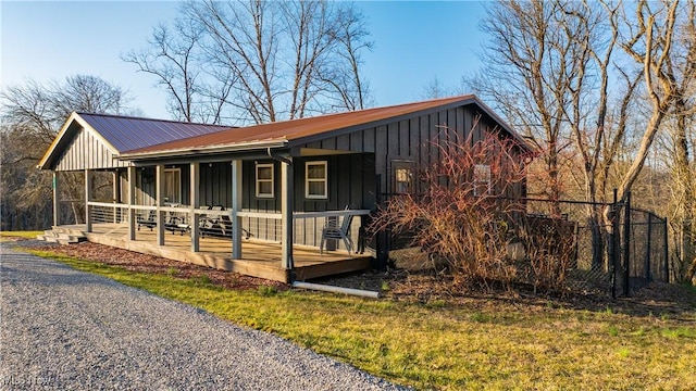 view of front facade featuring metal roof and board and batten siding