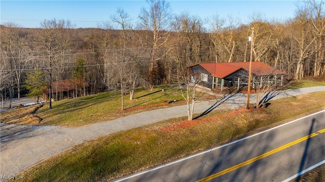 birds eye view of property with a forest view