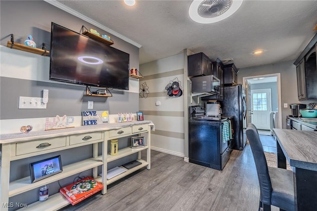 kitchen with black appliances, open shelves, a textured ceiling, wood finished floors, and baseboards