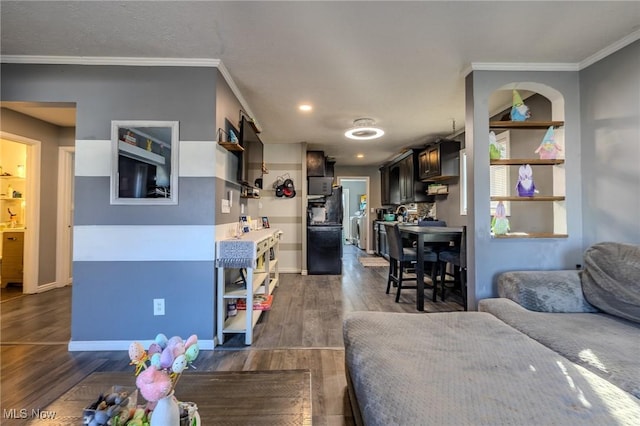 living area with dark wood-type flooring and crown molding