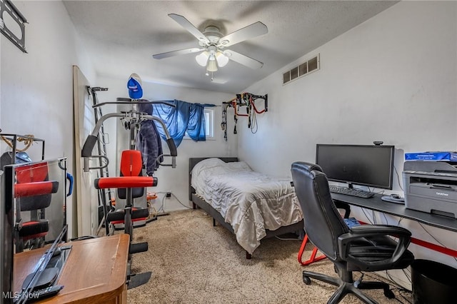 bedroom featuring visible vents, carpet flooring, and ceiling fan