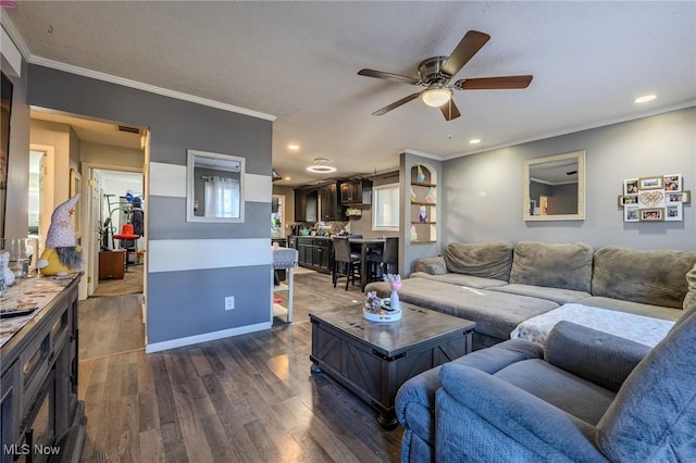 living area featuring ceiling fan, dark wood finished floors, recessed lighting, and ornamental molding