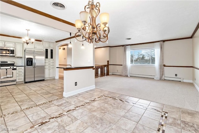 kitchen with dark countertops, visible vents, light colored carpet, a notable chandelier, and stainless steel appliances