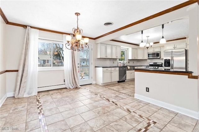 kitchen with dark countertops, visible vents, appliances with stainless steel finishes, and a chandelier