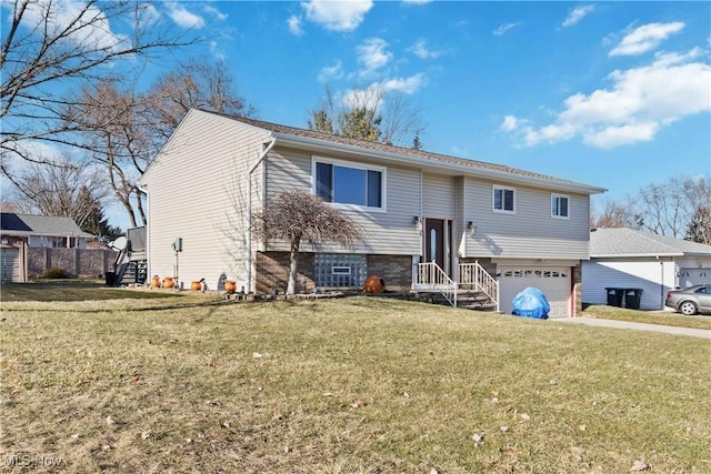 split foyer home with a front yard and an attached garage