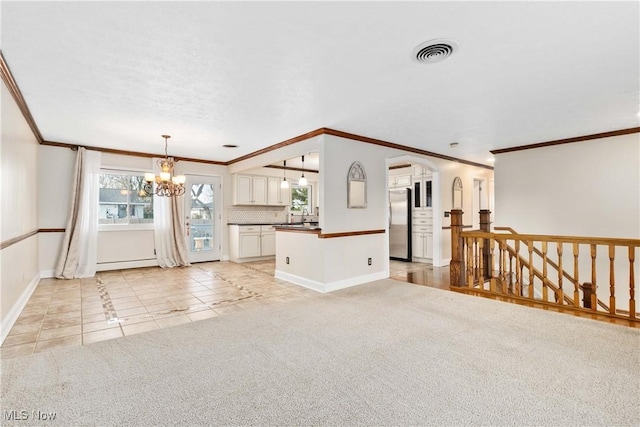 unfurnished living room with visible vents, an inviting chandelier, light tile patterned flooring, light colored carpet, and baseboard heating