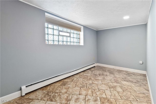 empty room with ornamental molding, a textured ceiling, baseboards, and a baseboard radiator