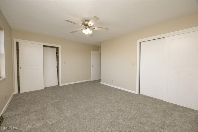 unfurnished bedroom featuring baseboards, carpet floors, and ceiling fan