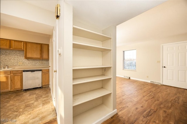 storage area with a sink and visible vents