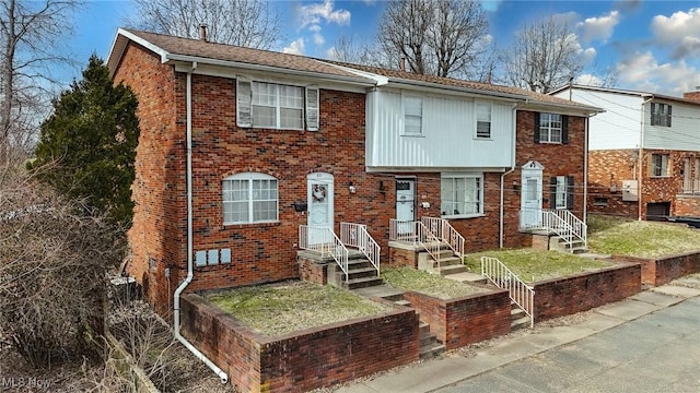 view of front facade featuring brick siding