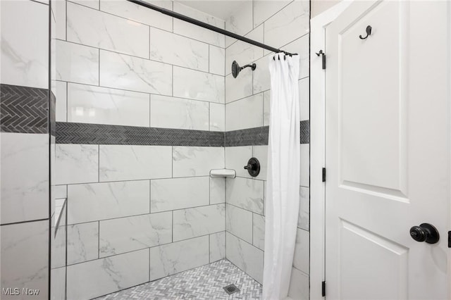 bathroom featuring a shower stall