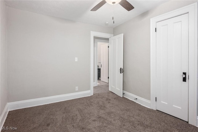 unfurnished bedroom with baseboards, ceiling fan, and carpet flooring